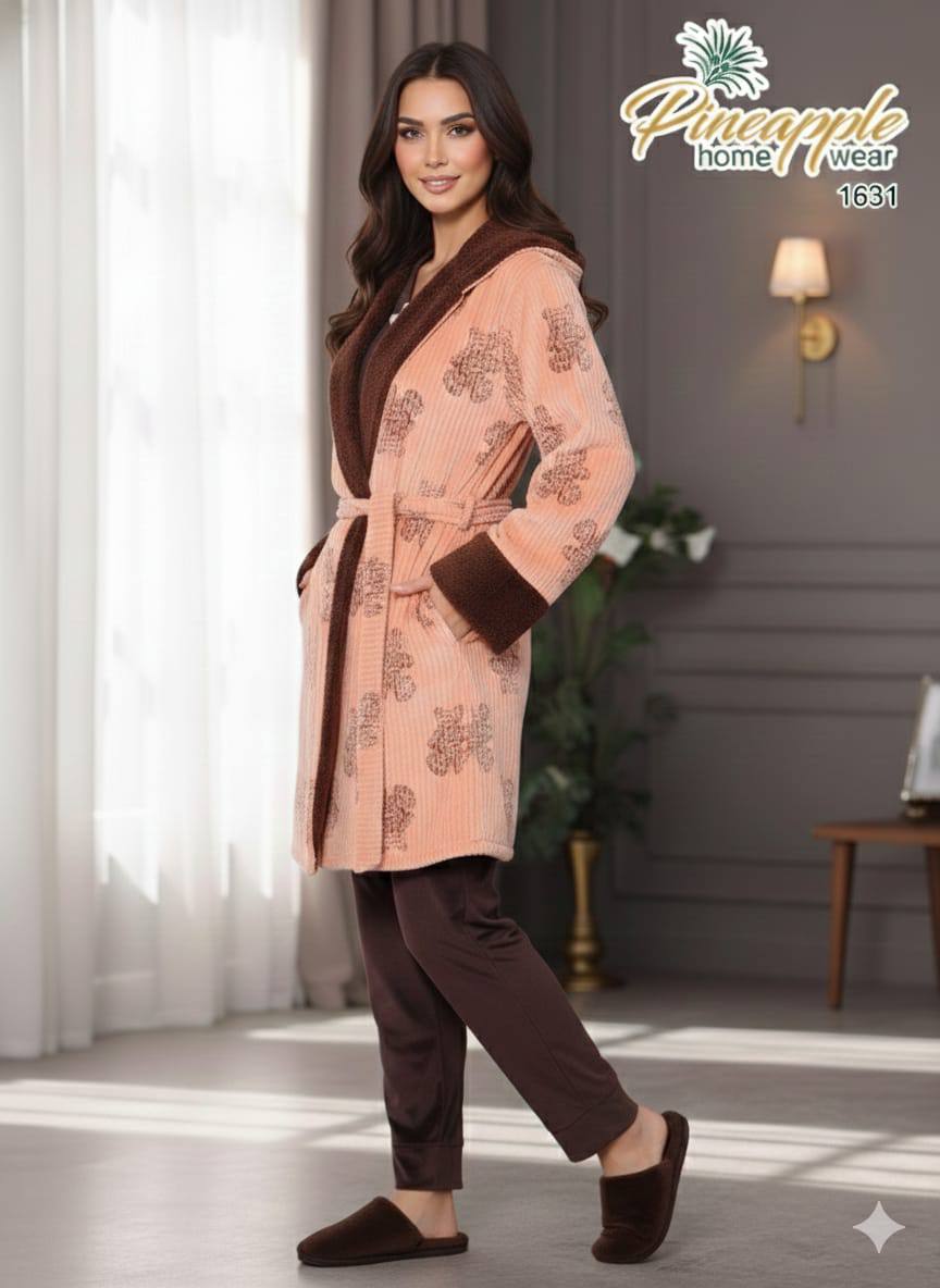 Woman wearing a patterned robe and pants in a home setting with 'Pineapple Home Wear' branding.