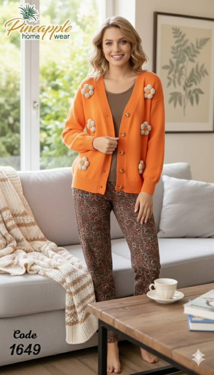 Woman wearing an orange floral cardigan in a living room setting