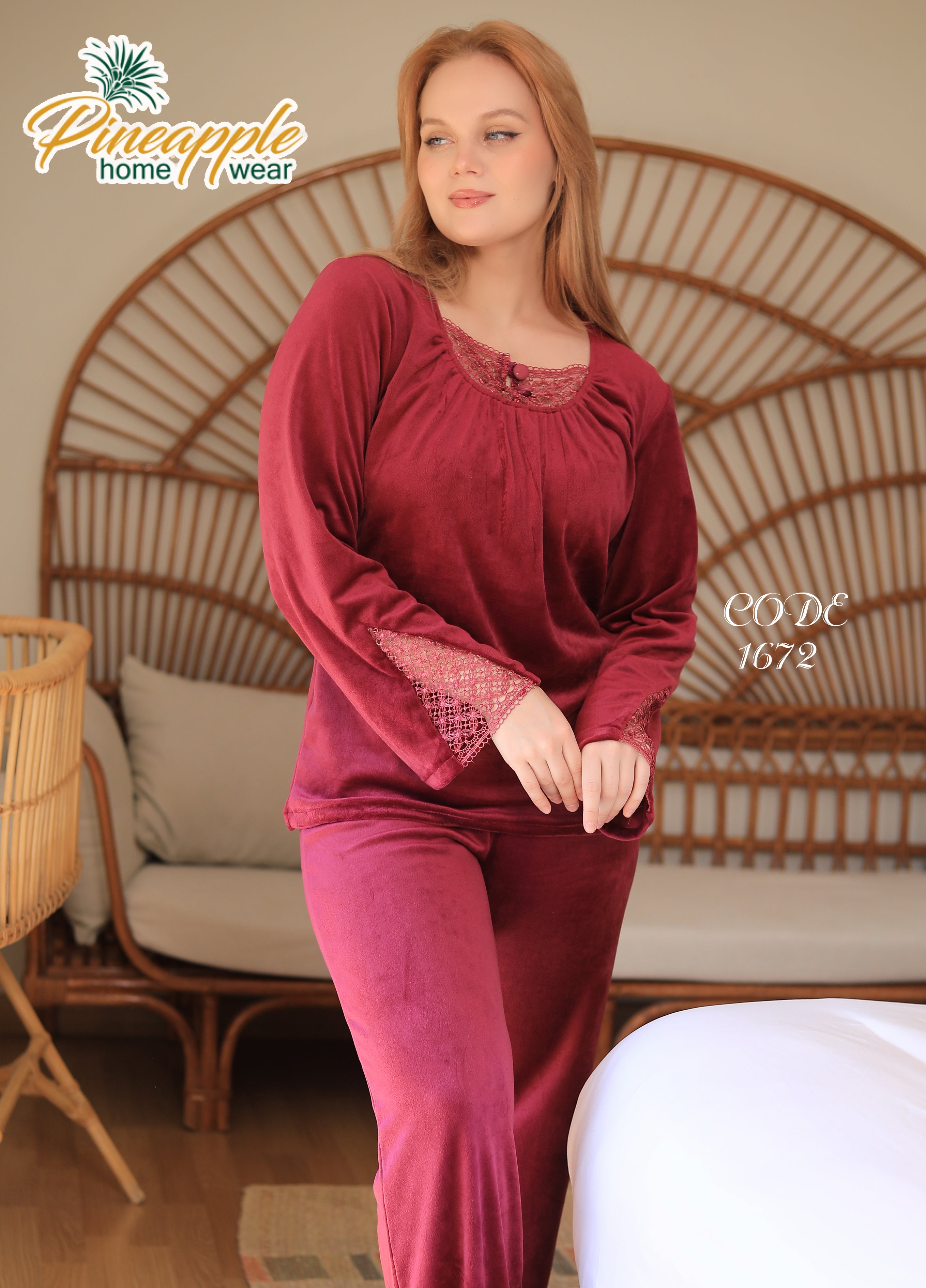 Woman wearing a burgundy pajama set with 'Pineapple Home Wear' branding in a home setting.