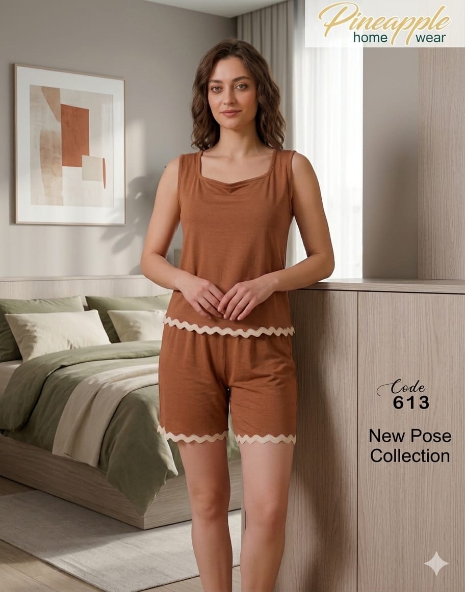 Woman wearing a brown pajama set in a bedroom setting with 'Pineapple Home Wear' branding.
