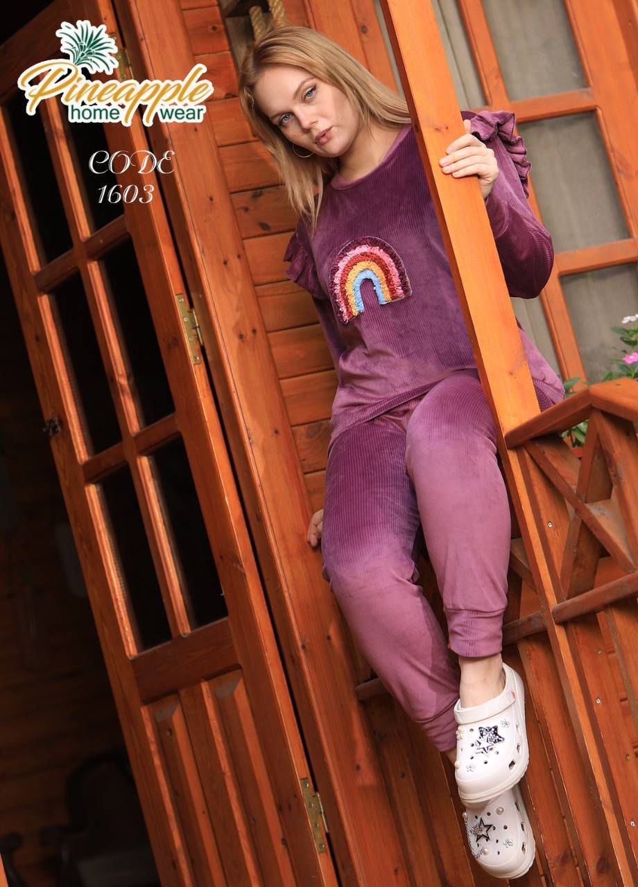 A playful purple ensemble featuring a rainbow motif